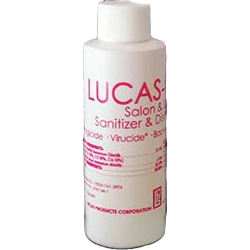 White bottle of Lucas' Saloon & Spa Sanitizer & Disinfectant with pink label on a white background