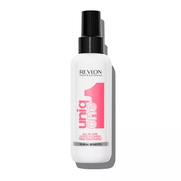 A bottle of UniqOne Hair Treatment with a pink label, indicating it is a leave-in hair treatment with ten real benefits.